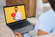 © New Africa - Long distance love. Woman having video chat with her boyfriend via laptop at home, closeup