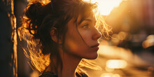 Young Woman In Sunset Light, A City's Evening Glow Softly Illuminates Her Contemplative Expression