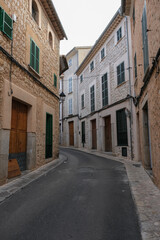 Medieval historic old house facades architecture in small alleys, streets and backstreets of Soller town on Balearic Island Mallorca, tourist destination in mountains station of Orange Express train