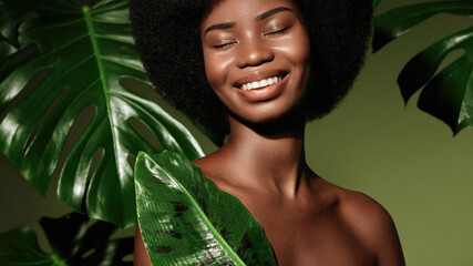 Wall Mural - organic cosmetics concept. beauty portrait of young beautiful african american woman with posing wit