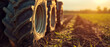 Golden Hour on the Farm: A Tractor Tire's Journey Through the Fertile Fields at Sunset