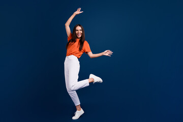 Sticker - Full length photo of carefree shiny lady wear orange t-shirt having disco fun empty space isolated dark blue color background