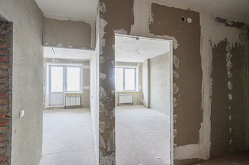 rough repairs for self-finishing. interior decoration, bare walls of the room, stage of construction. interior apartment room