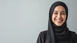 © Kartika - Close-up of a beautiful moslem woman smiling and looking at camera. Oriental beauty, fashion and healthy ideas.