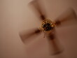 Ceiling fan. Creating air coolness on hot days. Dramatic cinematic atmosphere.