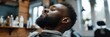 Portrait of a black man in a barbershop