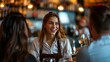 © somchai20162516 - Happy waitress chatting with group of guests in bar
