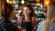 © somchai20162516 - Happy waitress chatting with group of guests in bar