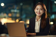 © Surachetsh - A smiling businesswoman works diligently on her laptop in the comfort of her home office, seamlessly blending work and happiness. Generative AI.