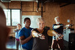 © Davor - Diverse senior people working out with trainer in gym