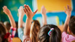 © henjon - Elementary students eagerly raising hands in class.. Shallow field of view.