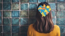 A Woman's Head Made Of Puzzle Pieces. Organisation Of Thoughts And Mental Health 
