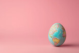 Fototapeta Pokój dzieciecy - A captivating image showcasing an Easter egg transformed into a miniature Earth globe through skillful painting, symbolizing global unity and celebration during the festive season.
