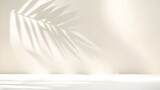 Fototapeta Dmuchawce - Blurred shadow from palm leaves on light cream wall. Minimalistic beautiful summer spring background for product presentation.