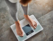 Top view crop faceless barefoot female standing at morning on digital weight and body fat scales with display