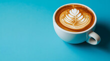 Hot Coffee Latte With Latte Art In A Ceramic White Cup Isolated On Soft Blue Background, Top Side View. Copy Space, Mock Up Product.
