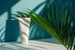  a white tube of lotion with a palm tree in