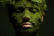 The face of a man with closed eyes covered with moss