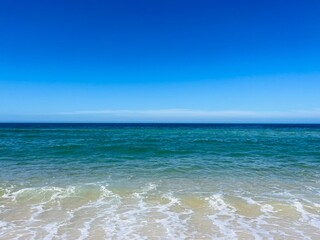 Pure blue sea horizon, blue seascape background, clear sky