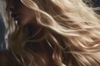 © okfoto - Close-up of a female model with luxurious, flowing blond hair, highlighting texture and shine, beauty and hair care concept.