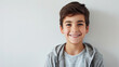 © ArtBox - Smiling boy in casuals against white background