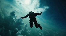 Skydiving Stunt Silhouette. The Grace Of A Skydiver's Dance In The Clutches Of Gravity. Freefall Fantasy