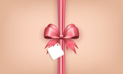 Wall Mural - Banner with realistic 3d pink bow with vertical silk ribbon and white label tag in the center on beige background. Wallpaper with bow with sticker - gift box design, present wrapping or greeting card