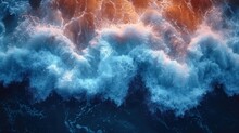  An Aerial View Of A Large Body Of Water With A Lot Of Waves Coming Up From The Top Of The Water And A Lot Of Orange And White Foam On The Bottom Of The Water.