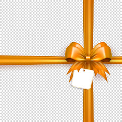 Wall Mural - Golden realistic 3d bow knot with crossed ribbon and paper label tag on transparent background. Bright glossy three dimensional crisscross tied bow with silk tape as gift or present wrapping element 