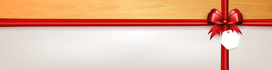 Wall Mural - Header with 3d red bow with crossed silk ribbons and paper label tag on white background with copy space. Bow with crisscross tapes as gift box wrap or greeting card with empty place for text