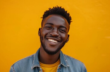 ethnic man smiling against yellow background