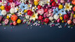 spring flowers pattern on dark blue color background, top view with copy space