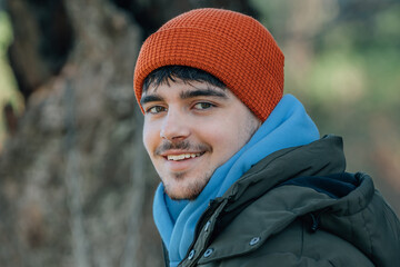 Poster - young man bundled up in winter outdoors