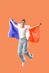 Poster - Young woman with flag of France jumping on orange background