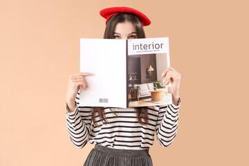 Sticker - Young woman with magazine on beige background