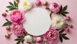 Mother's Day concept. Top view photo of white circle and natural flowers pink peony rose buds on isolated light pink background with empty space. International Woman Day, Valentine Day	