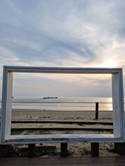 Wall Mural - It is a picture frame-shaped photo wall on the beach.