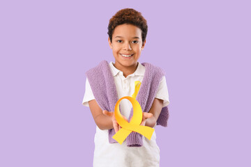 Poster - Cute little African-American boy with yellow ribbon on lilac background. Childhood cancer awareness concept