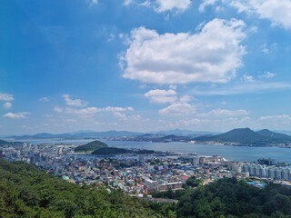 Canvas Print - This is an aerial shot of downtown Mokpo, with the sea visible in the distance.