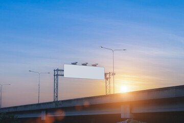 Wall Mural - Empty white billboards on city streets at sunset sky for advertising along the roads.