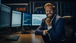 a moment of happiness as a young and successful, bearded trader looks at the camera with a smile while sitting in his modern office