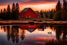 A Red Barn Reflected In A Pond With Canada Geese Swimming In The Pond, At Sunset, Near Sisters, Oregon