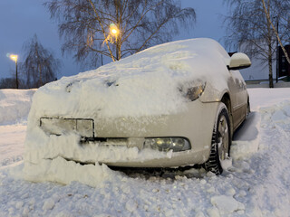 Wall Mural - Car covered with white snow