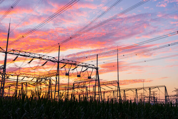 Wall Mural - The pylons are in the evening, Substation in the evening, High voltage substation and beautiful sunset glow