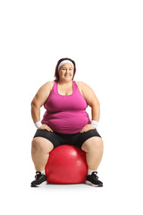 Poster - Corpulent woman sitting on an exercise ball