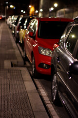 Canvas Print - Red car in the street at night