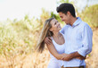 Happy couple, hug and embrace in nature for bonding, love support for outdoor affection or comfort. Face of young woman and man hugging for embrace or peaceful romance in forest or woods together