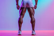 © Keitma - Back view of muscular fitness male model legs wearing underwear on colored background