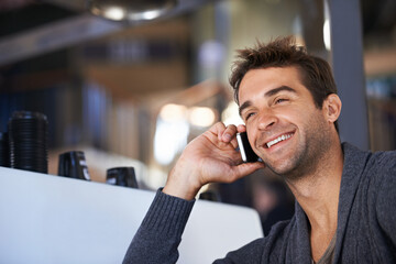 Poster - Phone call, happy and young man networking for deal, good news or work communication in cafe. Smile, satisfaction and male person on mobile conversation with cellphone for career in coffee shop.