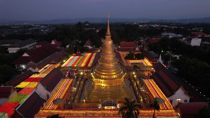 Wall Mural - Aerial view of Wat Phra That Haripunchai Woramahawihan during Loy Krathong festival, in Lapmhun, Thailand